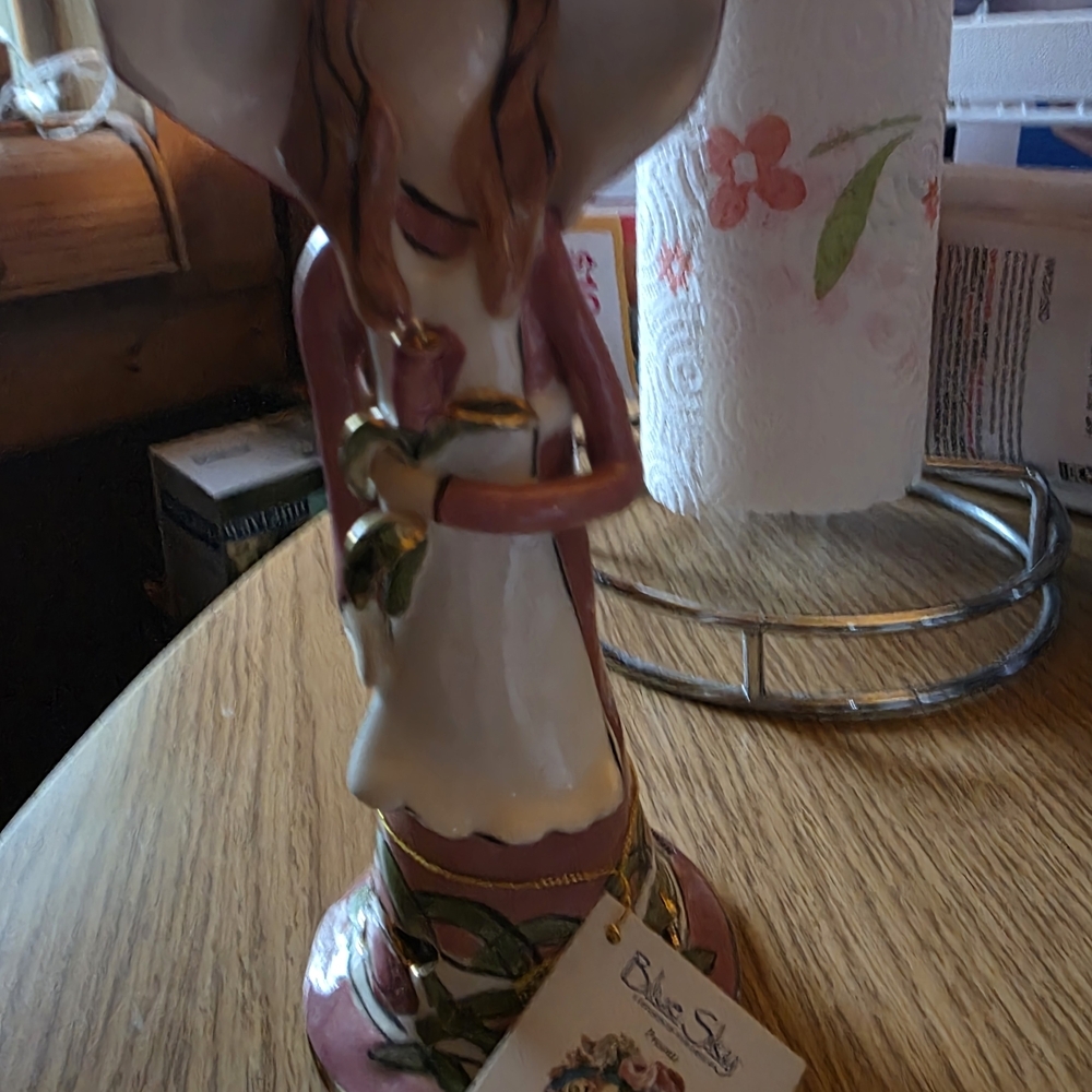 Blue Sky Pink and White Figurine